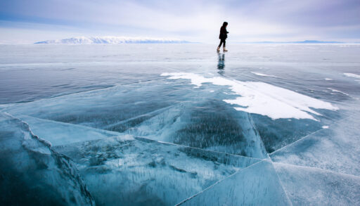 Person walking on frozen lake