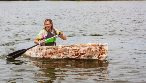 Girl in canoe made of fungi