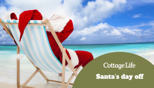 Santa Claus sitting on beach chairs with blue sky and cloud.Christmas Day concept.
