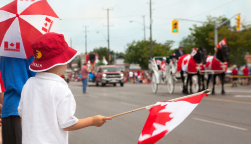 Boy watching a Canada Day parade.