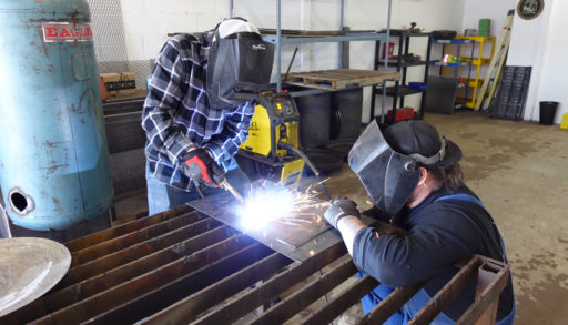 two men welding