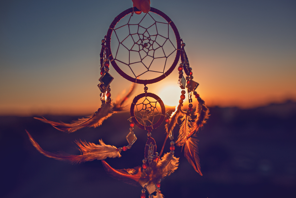 A dream catcher against the sunset