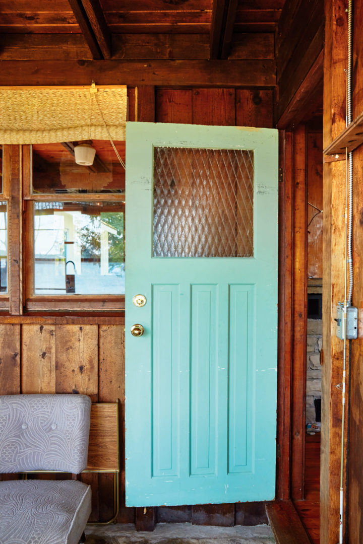 A green door in the screened porch at Heather Rice's cabin