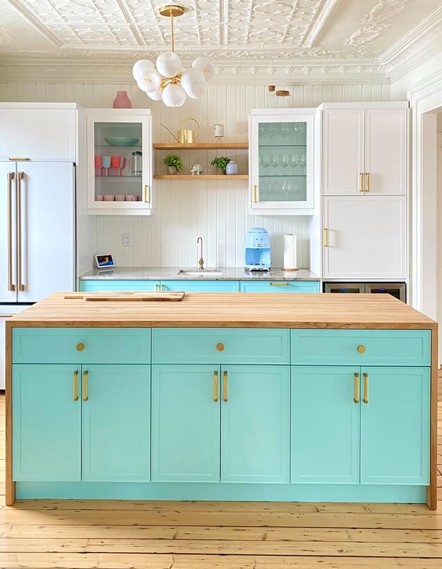 kitchen with turquoise island cabinets
