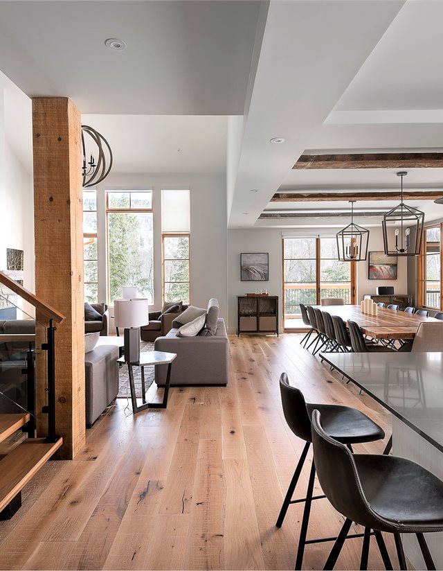 interior of living space with wooden floors and grey furniture