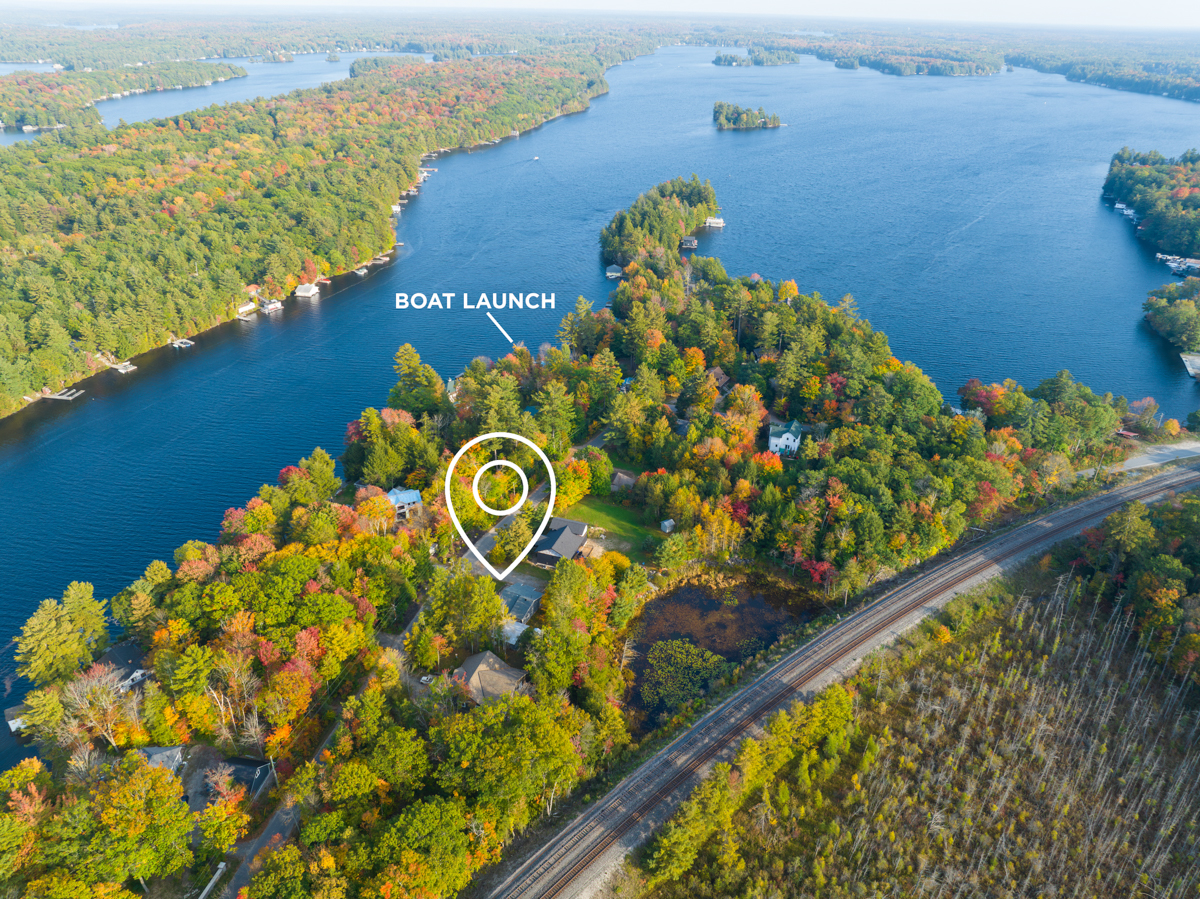Overhead view of Lake Muskoka, with illustrations indicating the cottage property and the nearby boat launch.