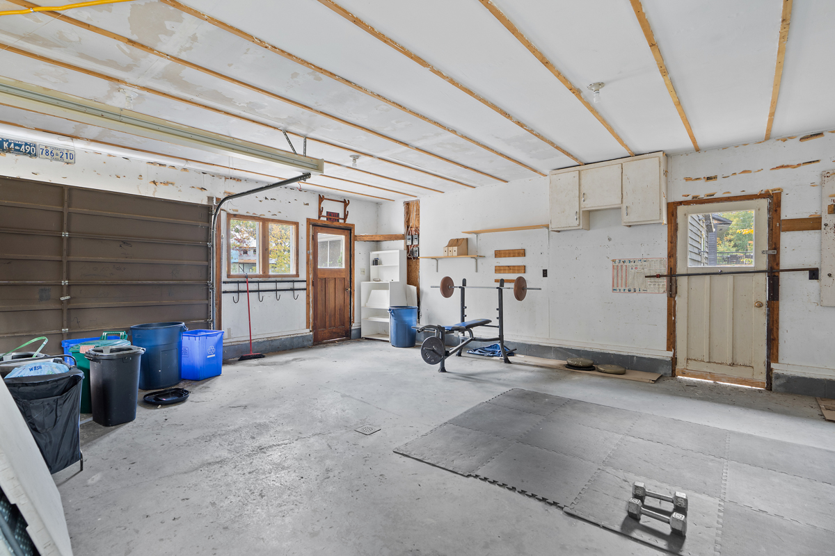 Interior of a garage with lots of empty space.