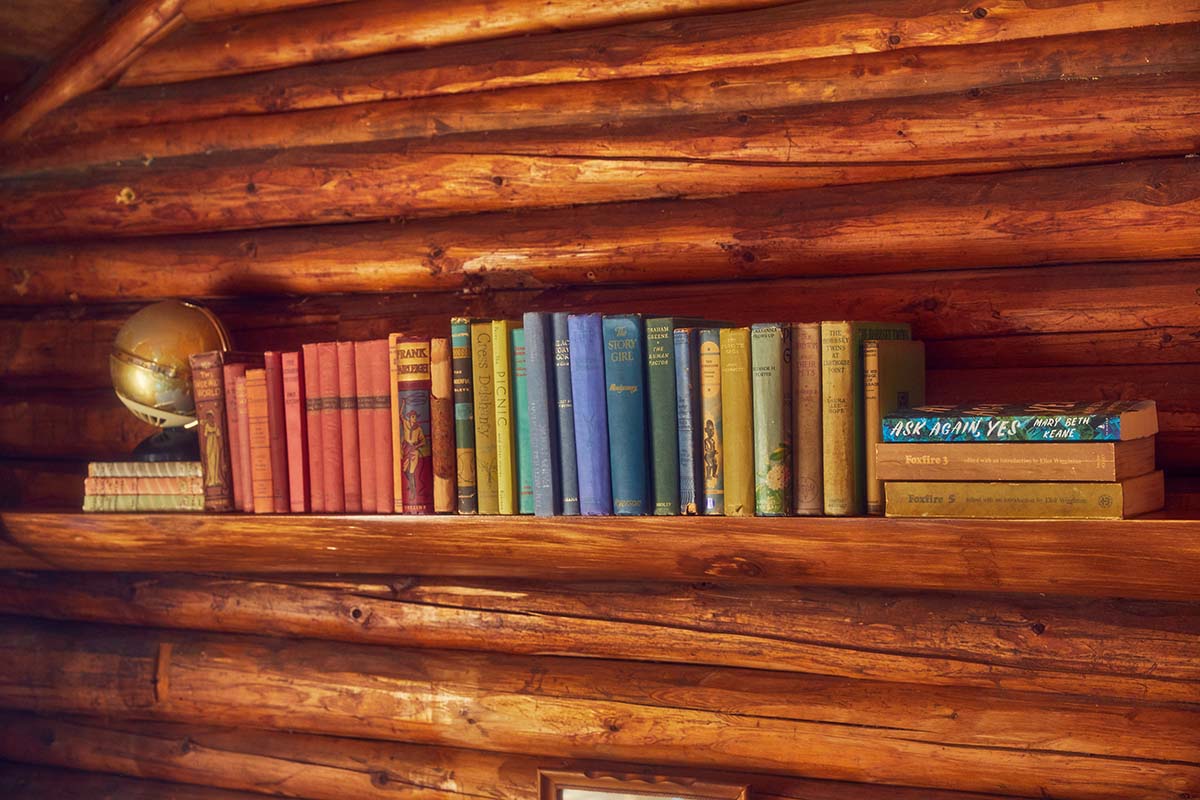 a photo of a bookshelf in a cottage