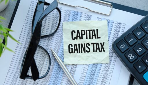capital gains tax written on a sticky note